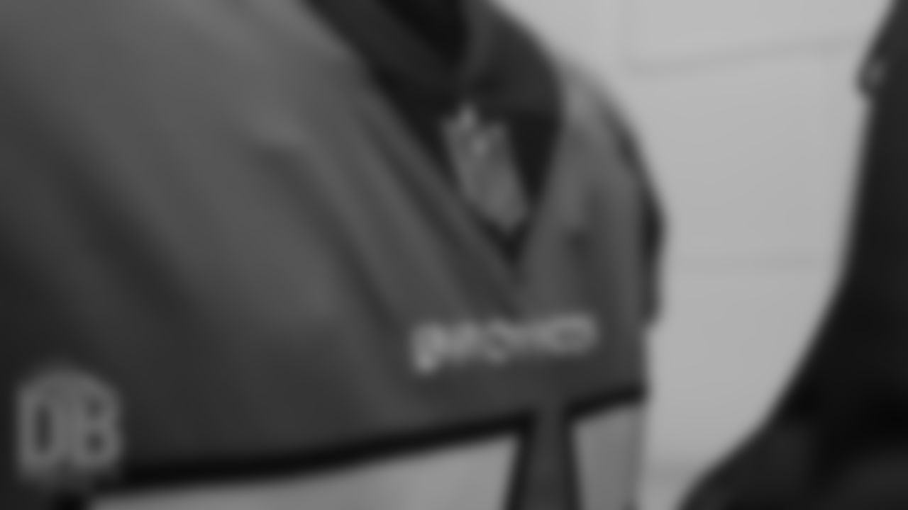 The NFL shield on the collar of a jersey inside the locker room pregame before the Broncos' preseason game against the Minnesota Vikings on August 11, 2018, at Broncos Stadium at Mile High.