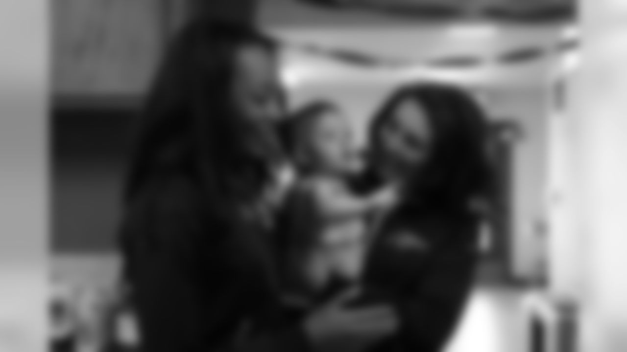 Denver Broncos Cheerleaders Eboni and Margaret pose with a young fan at La Puente Home shelter in Alamosa as part of the Broncos' 2015 Mile High Salute to Fans Tour. For more information on the shelter and how you can donate, please visit the shelter's website.