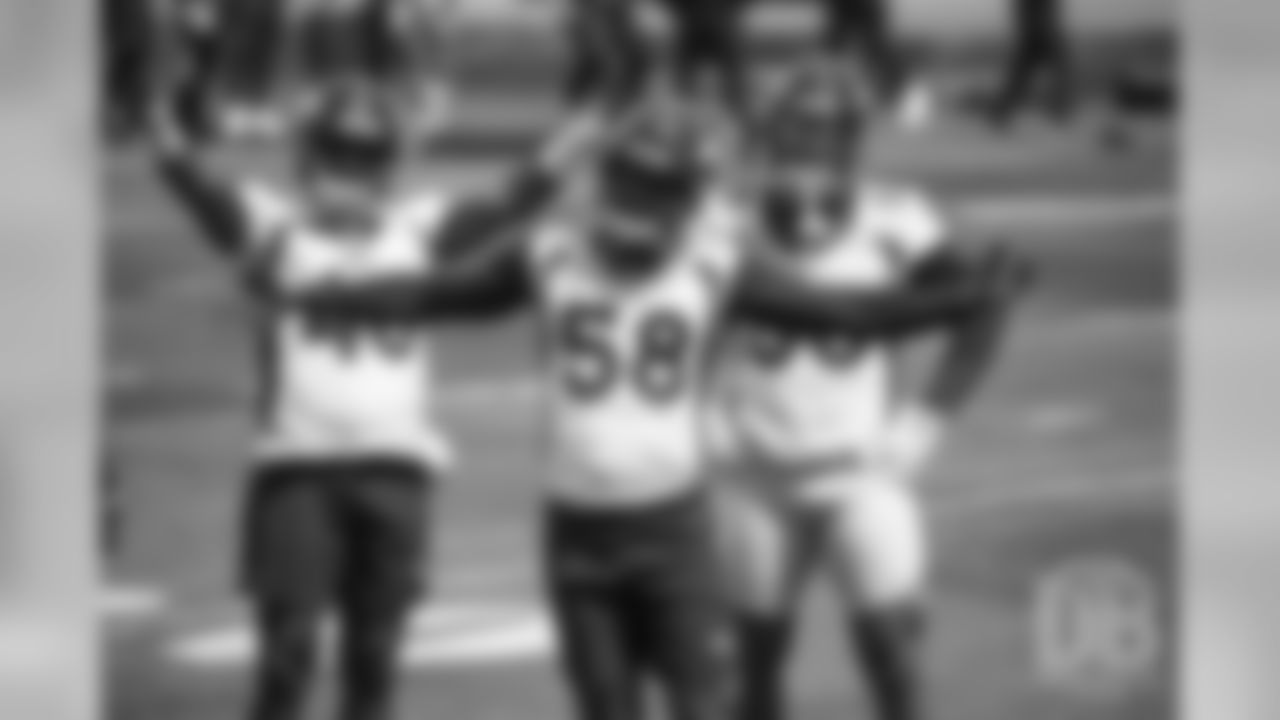 Von Miller, Jeff Holland and Bradley Chubb pose for a photo at the first day of voluntary veteran minicamp on April 16, 2019.