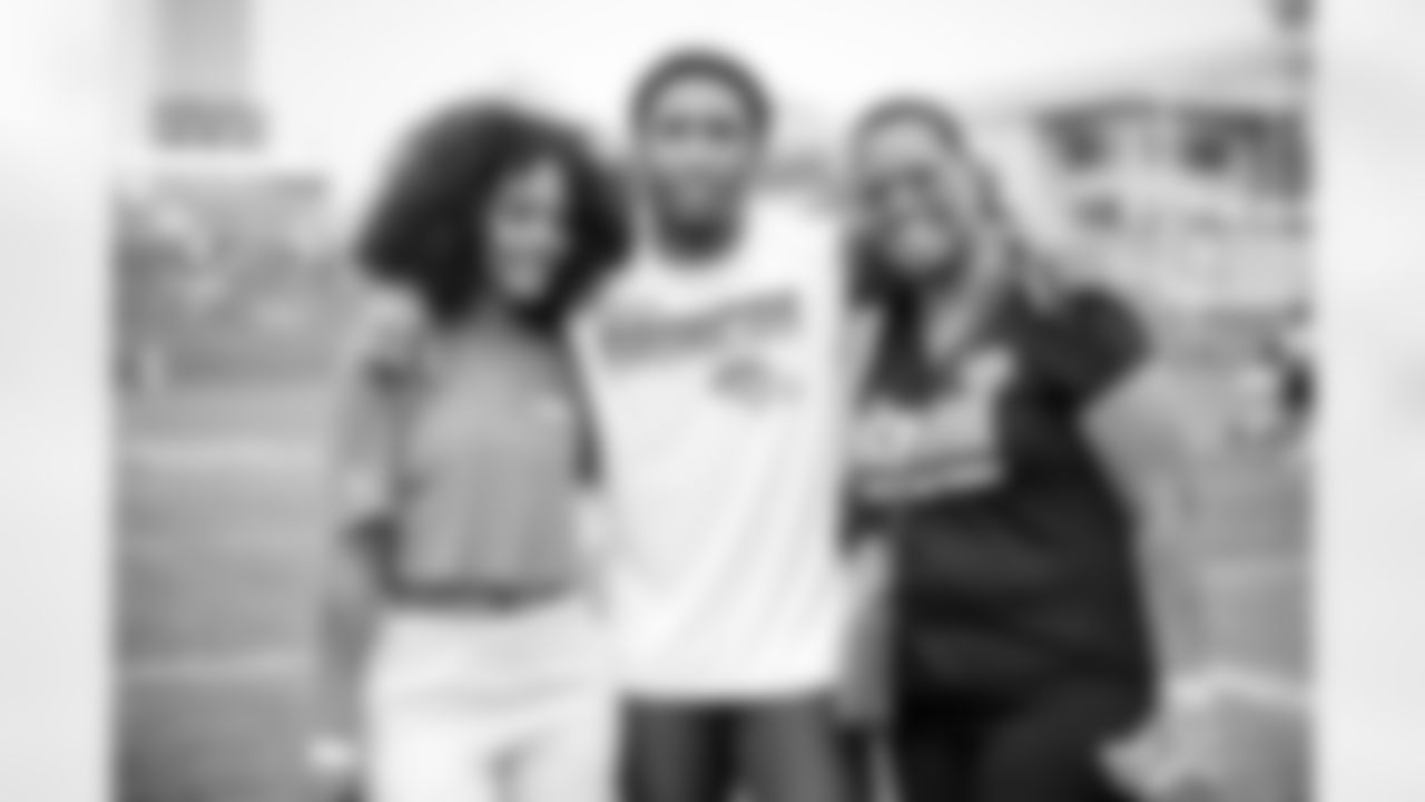Ronald Darby and his family after practice on Day 9 of training camp at UCHealth Training Center on August 7, 2021. (Photo by Ben Swanson)