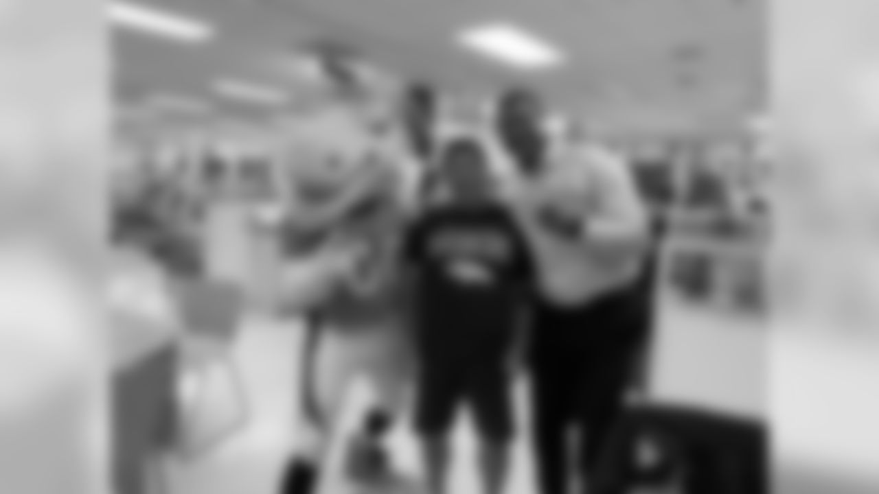Ring of fame former safety Steve Atwater and Miles the mascot at Vitalant's Drive for Life 22 blood drive in the Lowry neighborhood in Denver, Colorado on November 5, 2019.