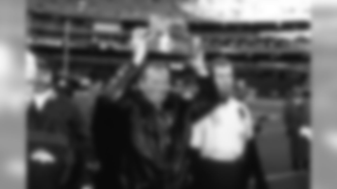 Owner Pat Bowlen carries the AFC Championship trophy after the win against the Pittsburgh Steelers at Three Rivers Stadium in Pittsburgh, PA on January 11, 1998.