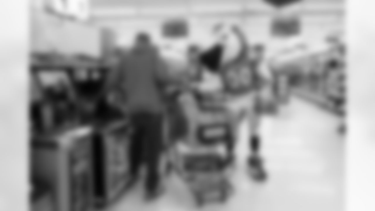 With help from Miles the mascot and Denver Broncos Cheerleaders, the Broncos gave away a total of $10,000 in groceries to Broncos fans at a King Soopers in Federal Heights, Colorado on January 3, 2021. (Photo by Ben Swanson)