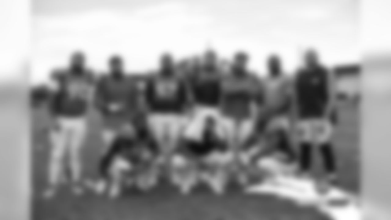 Billy Winn, Mike Purcell, DeMarcus Walker, Derek Wolfe, Dre'Mont Jones, Shelby Harris, Adam Gotsis, DeShawn Williams, Zach Kerr and Deyon Sizer after practice on Day 6 of training camp on July 24, 2019.
