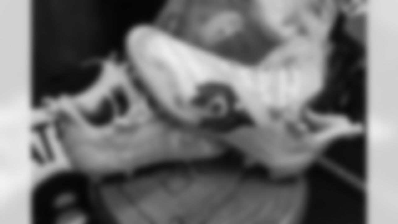 Tim Patrick's My Cause My Cleats for sarcoma awareness in the locker room before the Broncos' Week 13 game against the Kansas City Chiefs at GEHA Field at Arrowhead Stadium in Kansas City, Missouri on December 5, 2021. (Photo by Joe Abdellah)