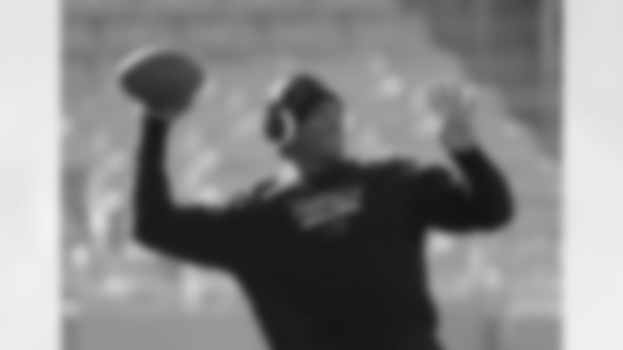 Carolina QB Cam Newton gets his arm loose during warmups.