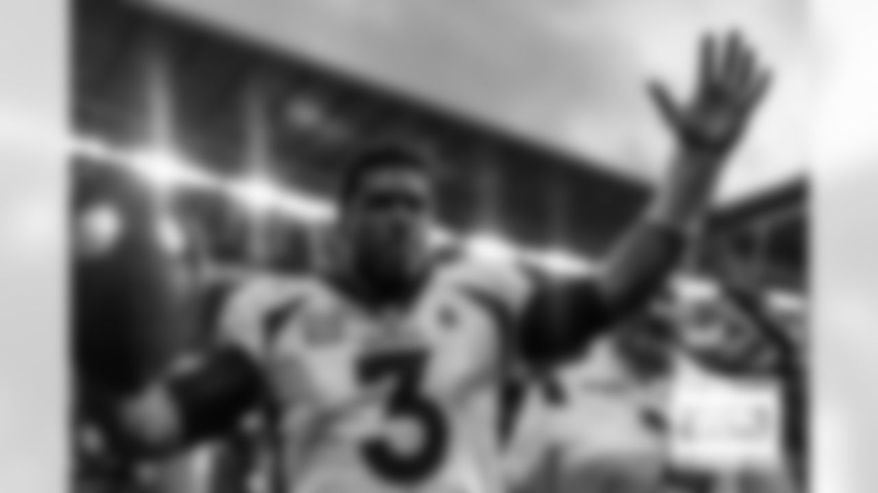 Russell Wilson pumps up the crowd in celebration after during the Broncos' Week 8 game against the Jacksonville Jaguars at Wembley Stadium in London, England in the United Kingdom on October 30, 2022. (Photo by Ben Swanson)
