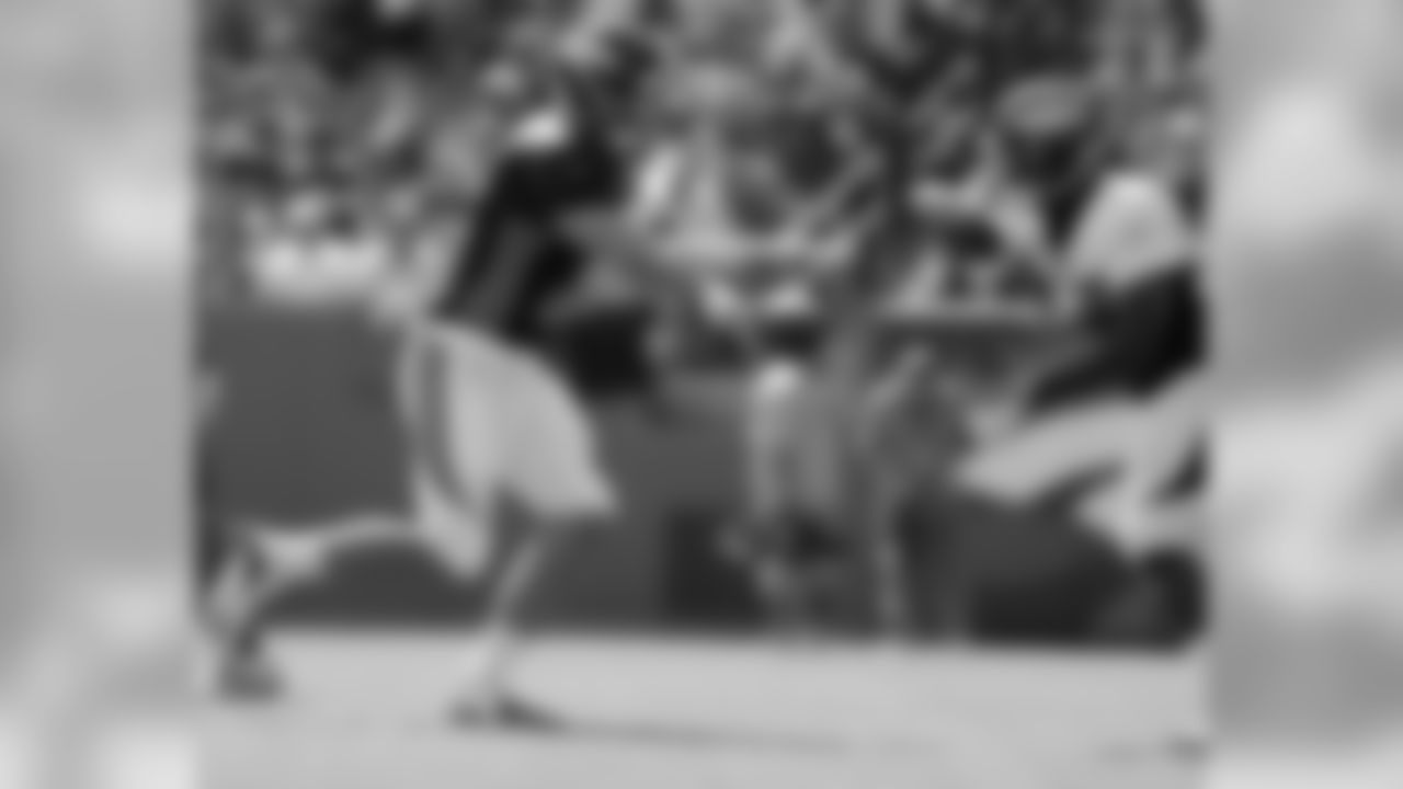 QB Brock Osweiler hands the ball off.