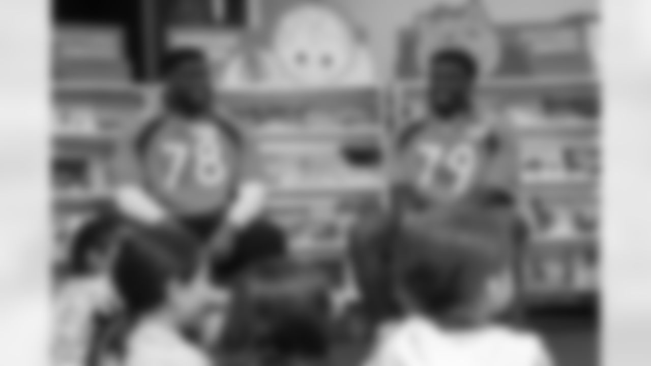 Lloyd Cushenberry III and Will Sherman during a Scholastic Book Fair at Montview Elementary School in Aurora, Colorado on September 12, 2023. Photo by Nicole Pennetta / Denver Broncos