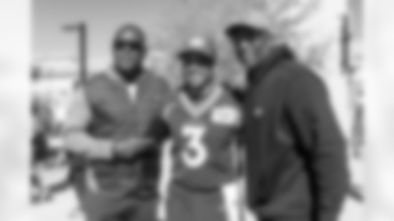 Byron Chamberlain, Russell Wilson and David Gamble at an alumni visit as part of the Super Bowl XXXII reunion weekend after walkthrough at UCHealth Training Center in Englewood, Colorado on October 22, 2022. (Photo by Ben Swanson)