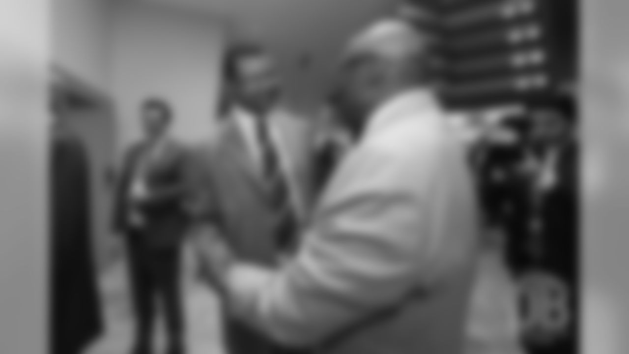Floyd Little greets Steve Atwater at the Pro Football Hall of Fame's Merlin Olsen Luncheon in Atlanta on February 1, 2019.
