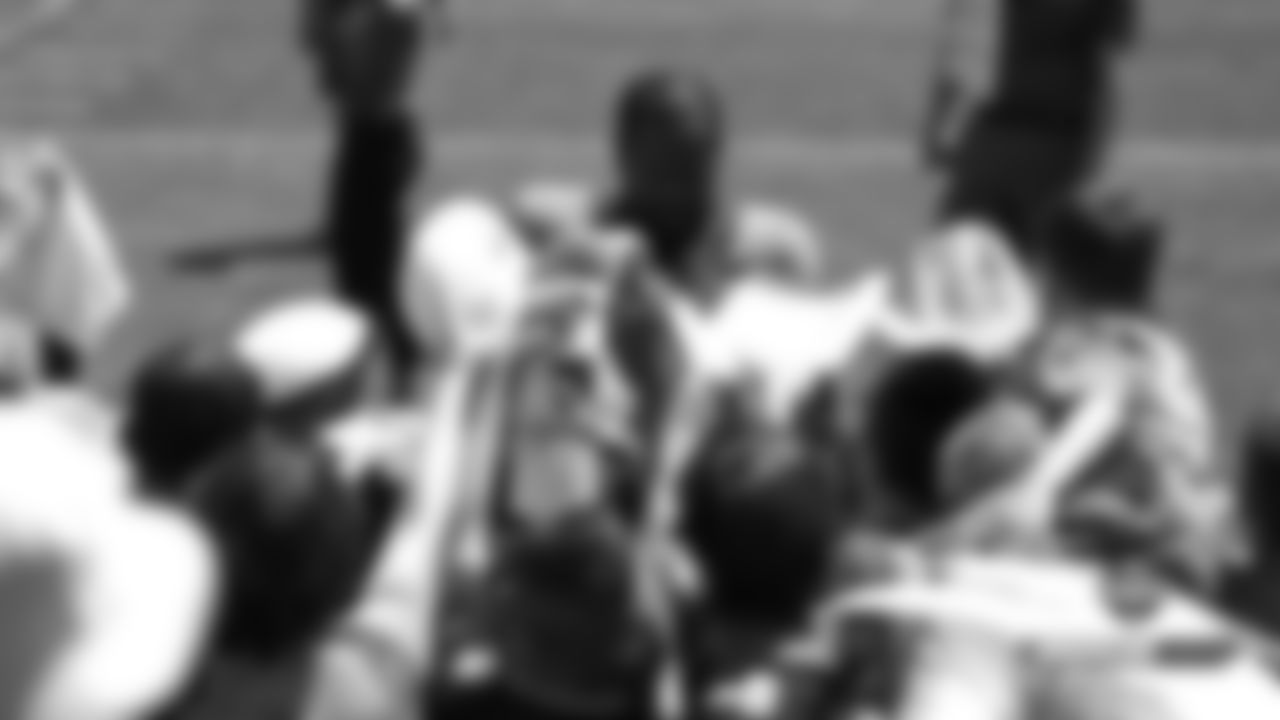 Von Miller signs autographs after practice on Day 8 of training camp on July 26, 2019.