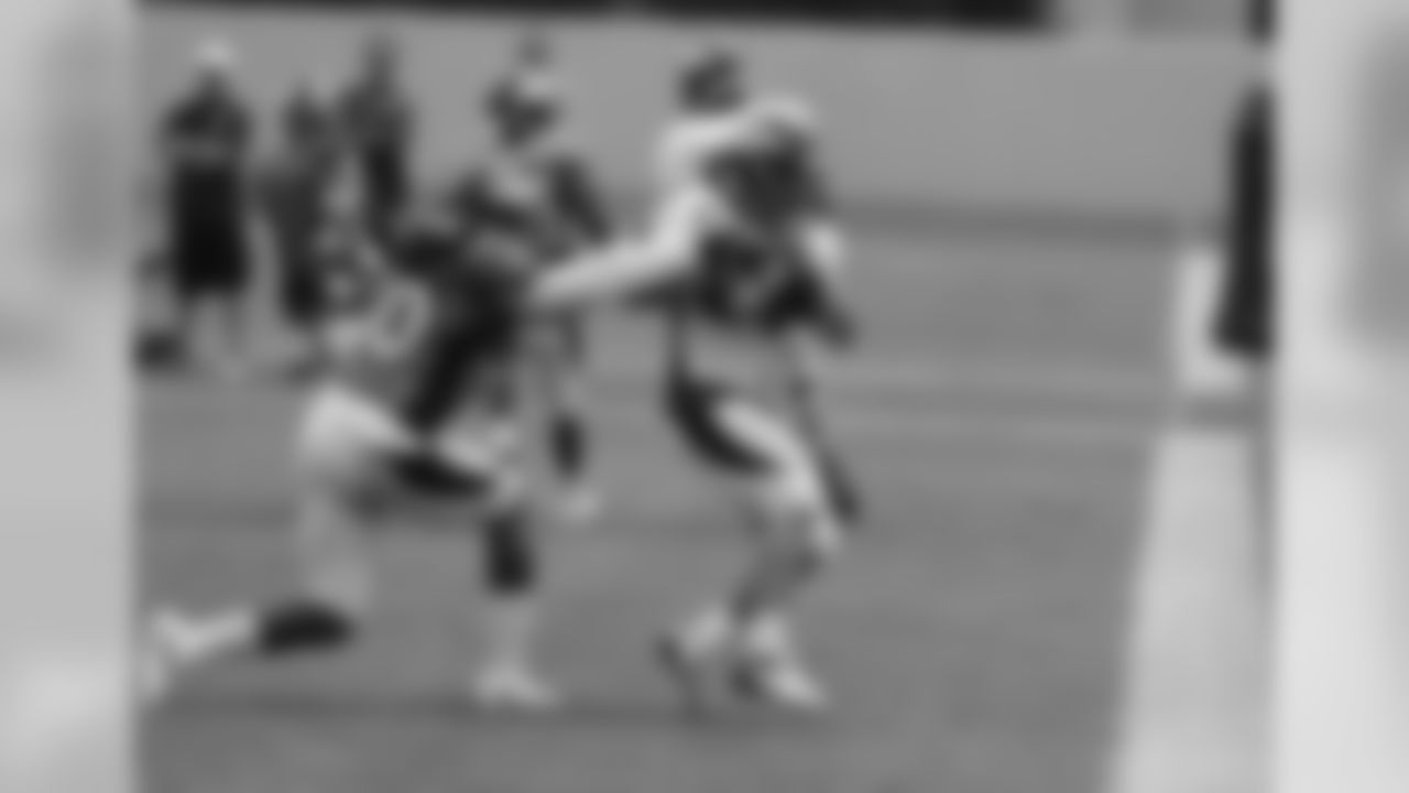Welker catches a pass in the back of the end zone.