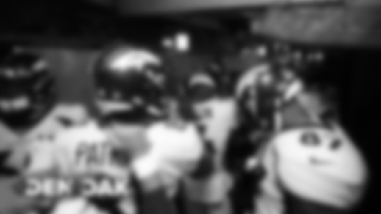 Offensive players, including Tim Patrick, Courtland Sutton and Noah Fant, huddle in the tunnel before the Broncos' game against the Oakland Raiders at Oakland-Alameda Coliseum on September 9, 2019. (Photo by Ben Swanson)