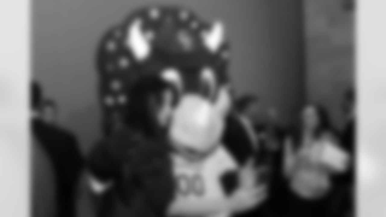 Colorado Rockies mascot Dinger poses with a fan for a selfie at the 2015 Make-A-Wish Sporting Affair Celebrity Waiter Dinner.