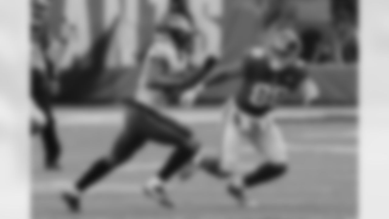 Philadelphia Eagles cornerback Ronald Darby, left, runs with the ball after intercepting a pass from New York Giants quarterback Eli Manning, not pictured, during the first half of an NFL football game, Sunday, Dec. 17, 2017, in East Rutherford, N.J. Giants' Evan Engram (88) tries to tackle Darby on the play. (AP Photo/Seth Wenig)