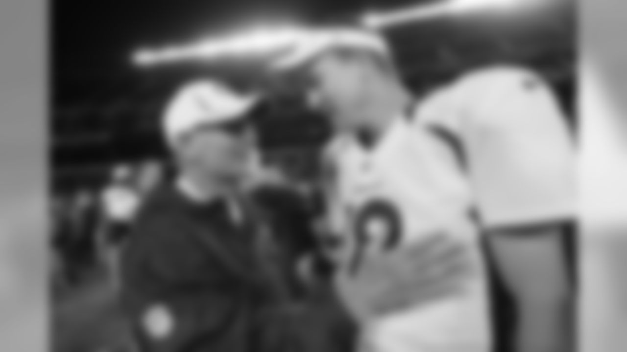 Manning has a word with Bears Defensive Coordinator Rod Marinelli after the game.