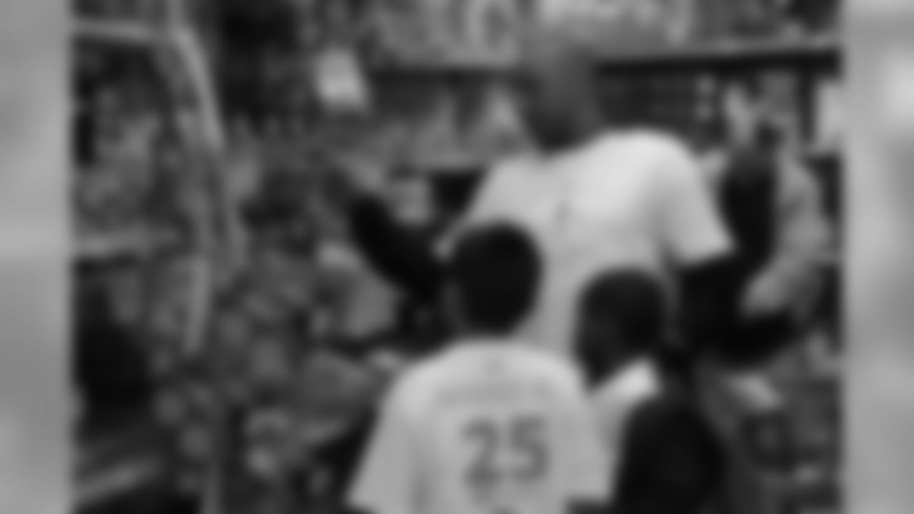 Chris Harris Jr. hosts his 2018 "Shop with a Jock" event, in which he gives 50 children a shopping spree and dinner.