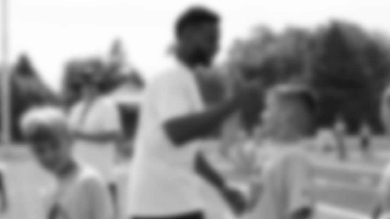 Emmanuel Sanders interacts with children at his youth football camp at Thomas Jefferson High School in Denver on July 1, 2019.