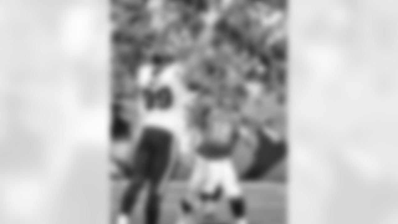 Manning looks over DE J.J. Watt, who finished with seven tackles, 2.5 sacks and four tackles for a loss.