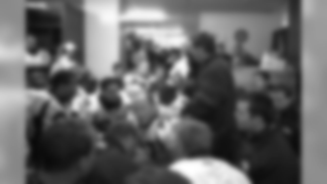 Head Coach Mike Shanahan addresses the team in the locker room after the Broncos win their second round playoff game against the Kansas City Chiefs at Arrowhead Stadium in Kansas City on January 4, 1998.
