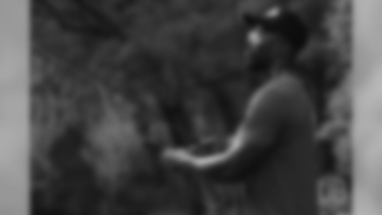 Von Miller tries his hand at fly fishing at the fishing portion of Von Miller's Pass Rush Summit at Dogwood Canyon Nature Park on June 28, 2018.
