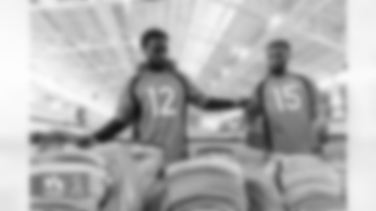 Montrell Washington and Jalen Virgil during an event in which players wrote cards to military members and assembled care packages as part of Salute to Service month activities at UCHealth Training Center on November 15, 2022. (Photo by Ben Swanson)