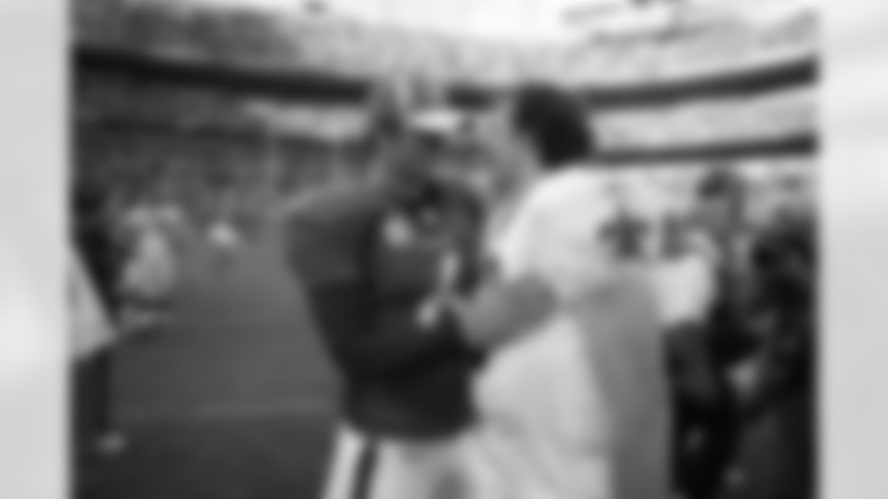 Jay Cutler exchanges some pleasantries after the game with New Orleans Saints quarterback Drew Brees at Invesco Field September 21, 2008