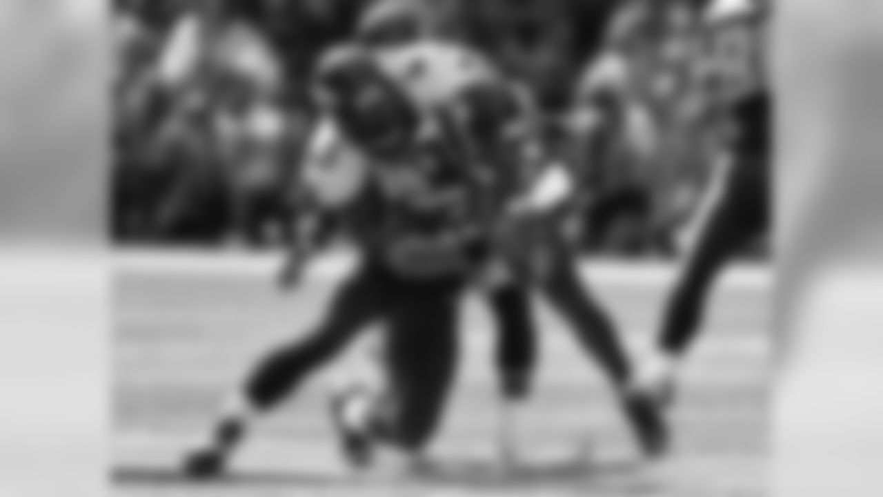 Safety T.J. Ward tackles Russell Wilson.