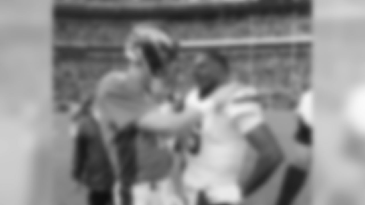 Quarterback Peyton Manning (18) and Minnesota Vikings quarterback Teddy Bridgewater (5) talk after the game at Sports Authority Field in Denver on October 4, 2015. Photo by Ben Hays.