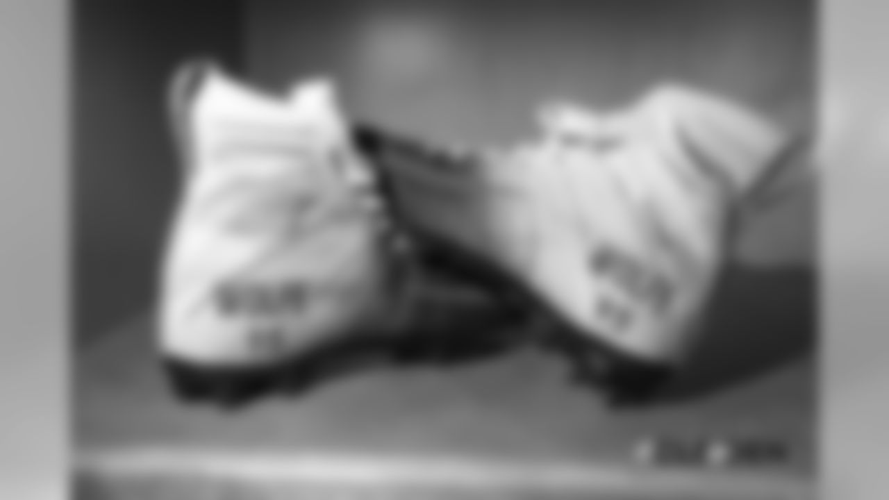 Derek Wolfe's cleats in the locker room before the Broncos' Week 15 game against the Cleveland Browns at Broncos Stadium at Mile High on December 15, 2018.
