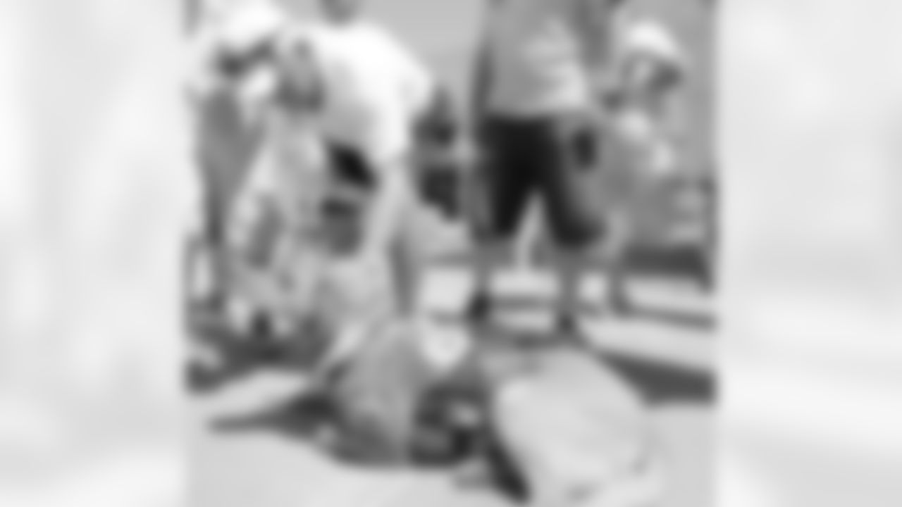 Fox pets the Wounded Warriors' service dog.