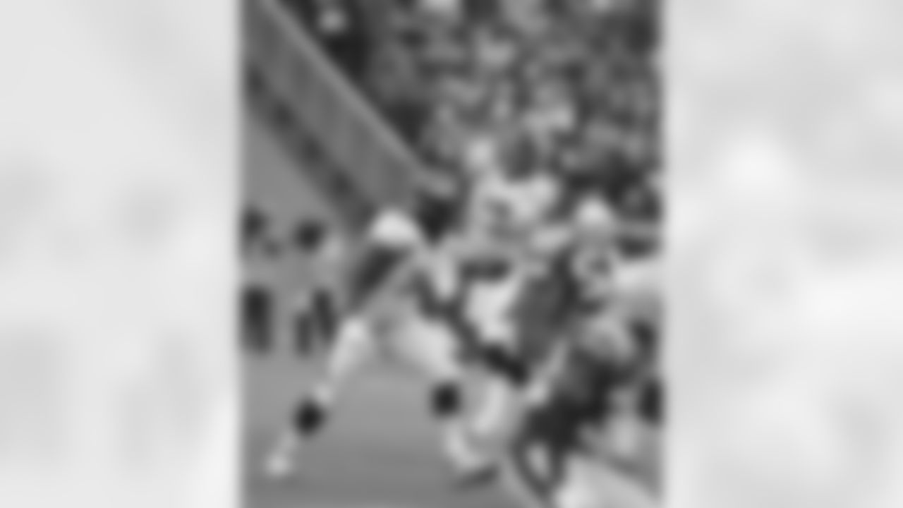 QB Peyton Manning throws the ball short during first-half action against the New England Patriots.