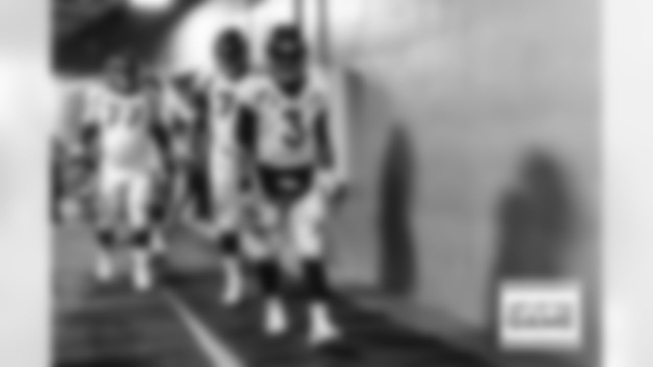 Russell Wilson walks out of the tunnel during player and team introductions before the Broncos' Week 12 game against the Carolina Panthers at Bank of America Stadium in Charlotte, North Carolina on November 27, 2022. (Photo by Ben Swanson)