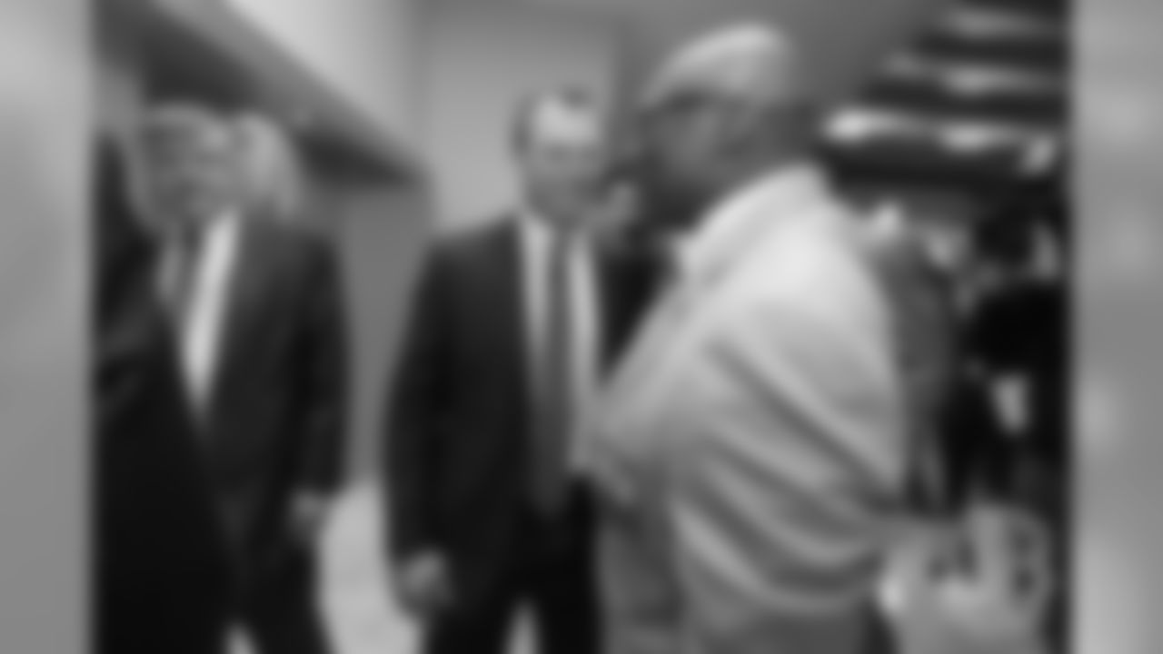 John Lynch talks with Floyd Little at the Pro Football Hall of Fame's Merlin Olsen Luncheon in Atlanta on February 1, 2019.