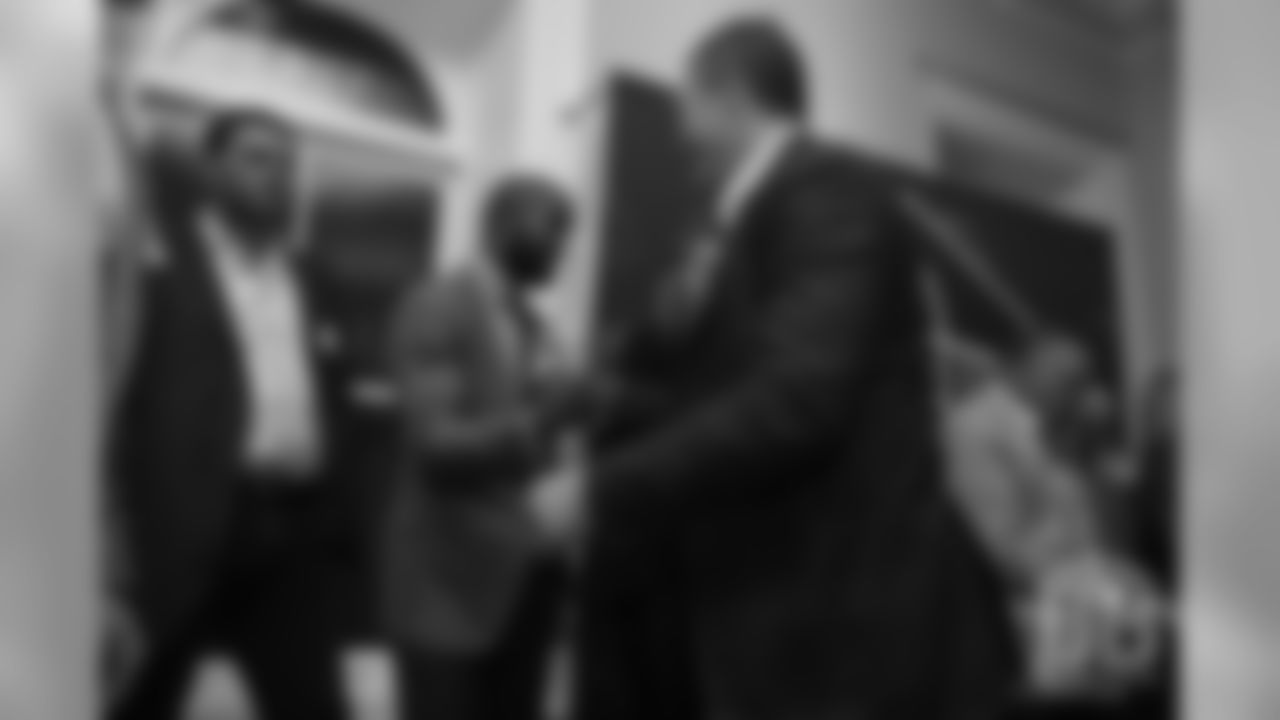 John Lynch greets Champ Bailey during a presentation of the Hall of Fame finalists at the Pro Football Hall of Fame's Celebration of Excellence Reception in Atlanta on January 31, 2019.