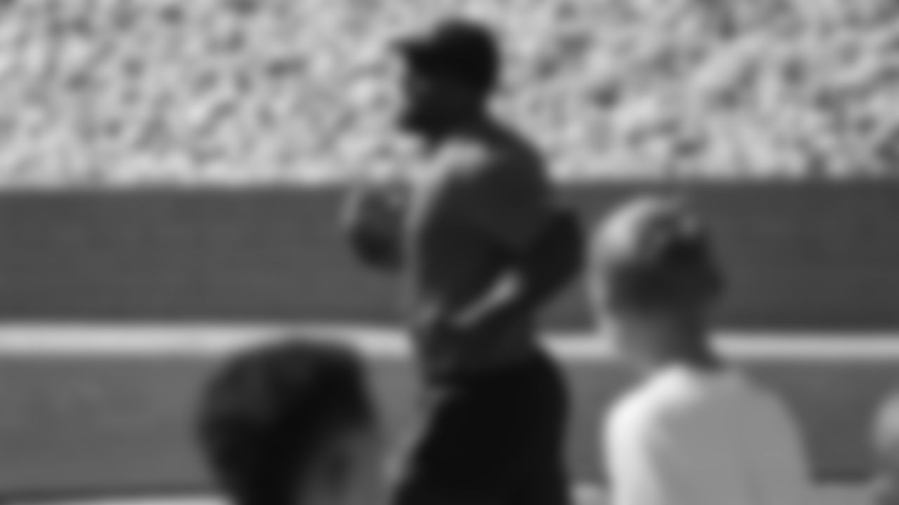 Von Miller interacts with children at his youth football camp at Englewood High School on June 20, 2019.