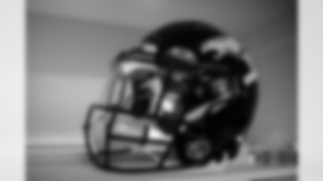 A helmet in the locker room before the Broncos' Week 3 game against the San Francisco 49ers at Empower Field at Mile High in Denver, Colorado on September 25, 2022. (Photo by Ben Swanson)