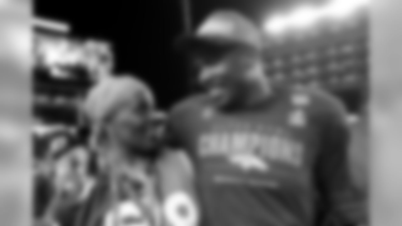 Denver Broncos' Von Miller, right, walks off the field with his mother Gloria after the NFL Super Bowl 50 football game against the Carolina Panthers Sunday, Feb. 7, 2016, in Santa Clara, Calif. The Broncos won 24-10. (AP Photo/Jae C. Hong)