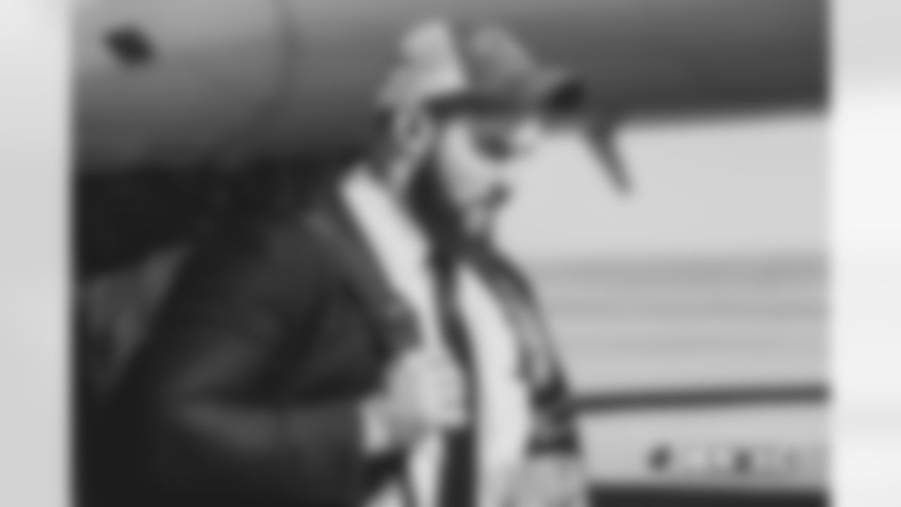 Andy JanovichÊwalks on the tarmac to the plane before the flight during the team's travel for their Week 8 game against the Kansas City Chiefs on October 27, 2018.
