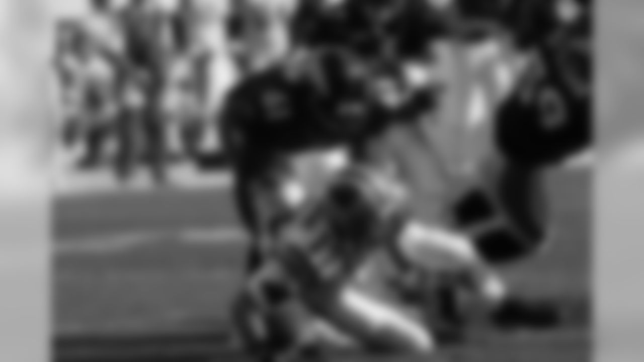 Ellis Johnson sacks Jake Delhomme during the NFL game against the Carolina Panthers on October 10, 2004 at Invesco Field at Mile High in Denver, Colorado.