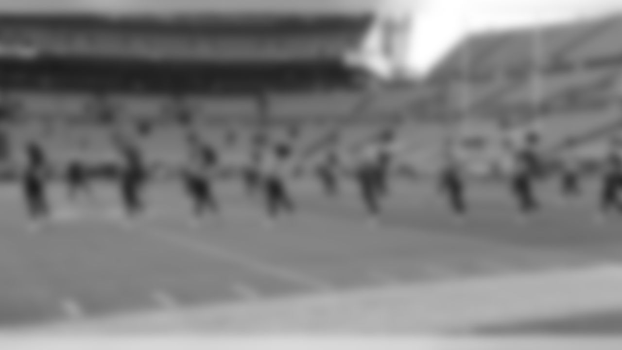 The cheerleaders practice their dance routine prior to Sunday's kickoff.