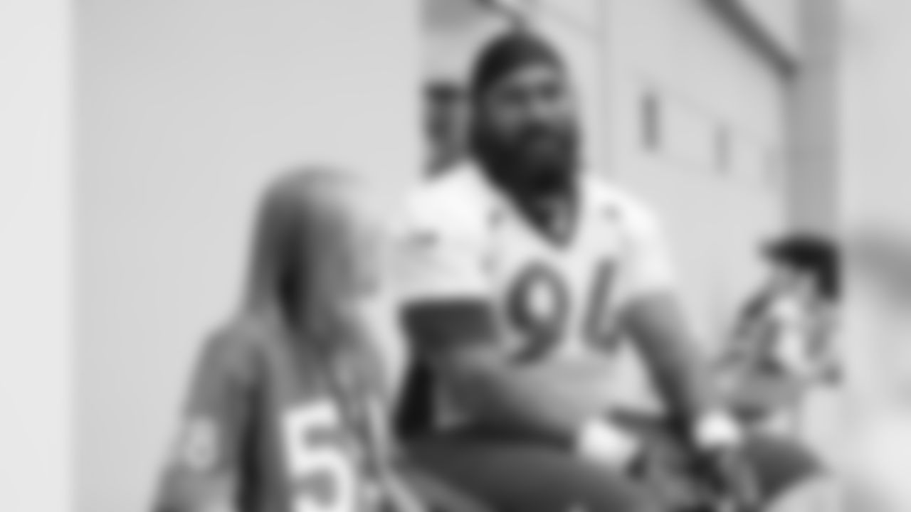 Children's Hospital Colorado junior reporter Kaylea interviews Domata Peko Sr. after practice on September 5, 2018 at UCHealth Training Center.