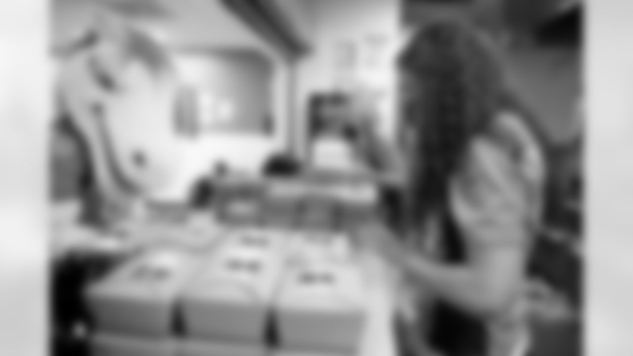 Denver Broncos Cheerleaders and Miles the Mascot delivery more than 1,800 gourmet boxed lunches, prepared by Epicurean Catering, to healthcare professionals, local nonprofits, first responders, teachers, and essential and frontline workers.