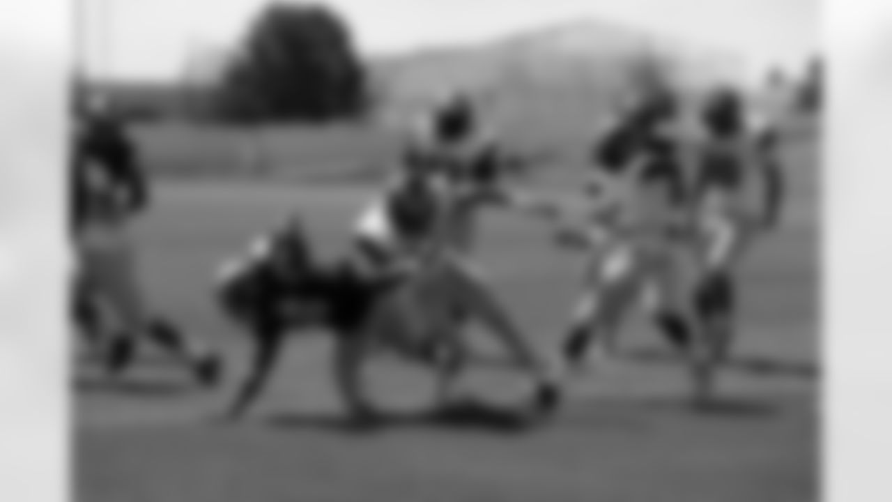 A CSU running back takes a big hit as he crosses the goal line for a touchdown.
