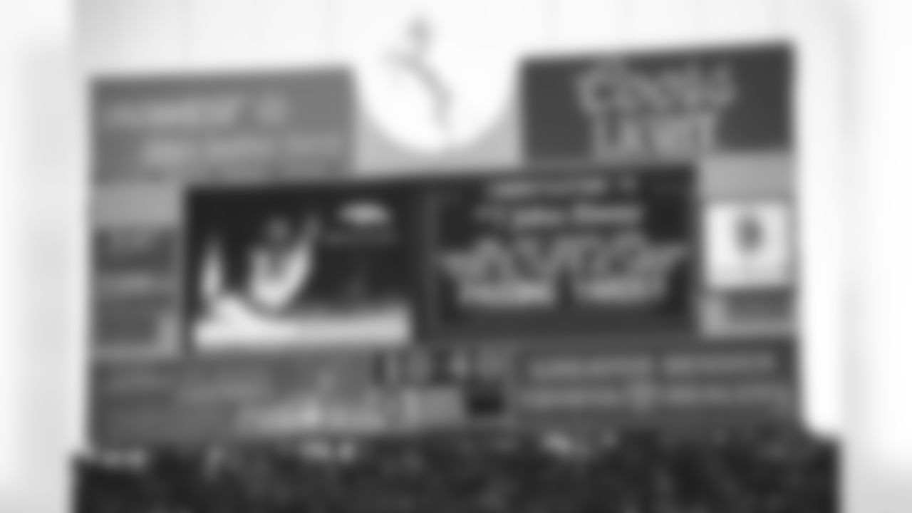 Denver: The scoreboard reads that John Elway just surpassed Fran Tarkenton for second place all time in passing yards against the Seattle Seahawks at Mile High Stadium in Denver, CO on November 2, 1997.