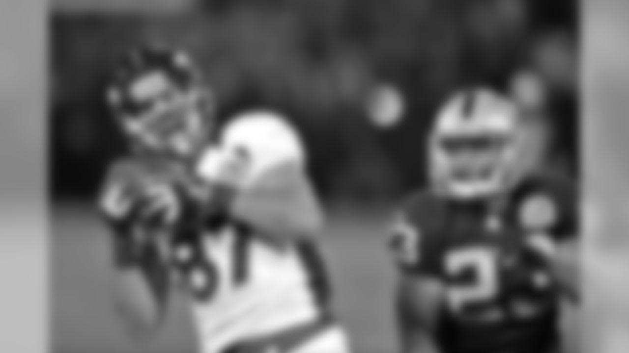 Decker hauls in a deep pass along the sideline.