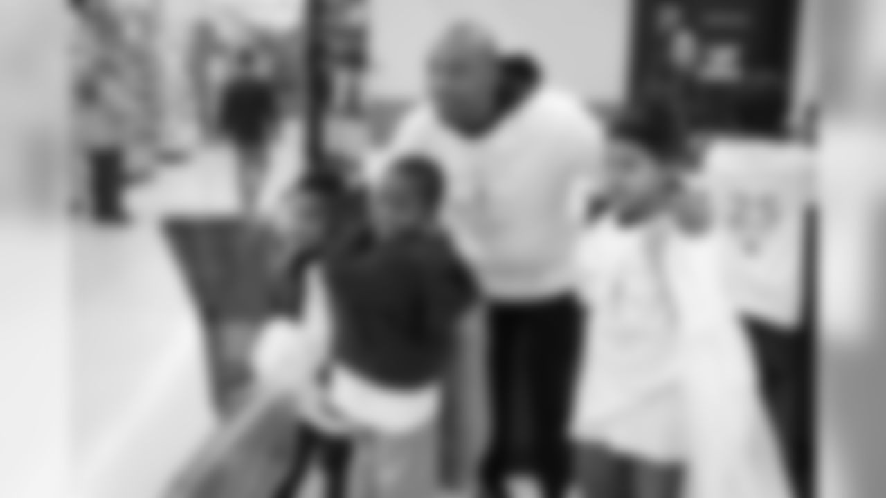 Chris Harris Jr. hosts his 2018 "Shop with a Jock" event, in which he gives 50 children a shopping spree and dinner.