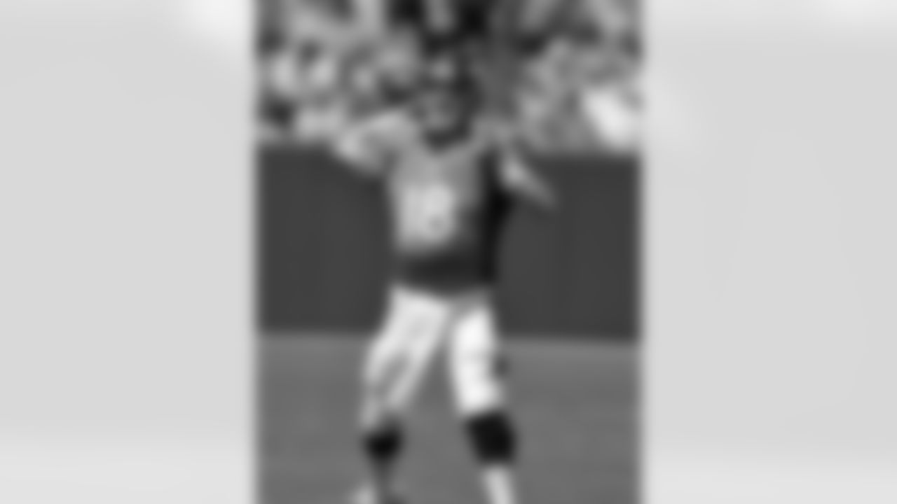 Quarterback Peyton Manning drops back to pass.