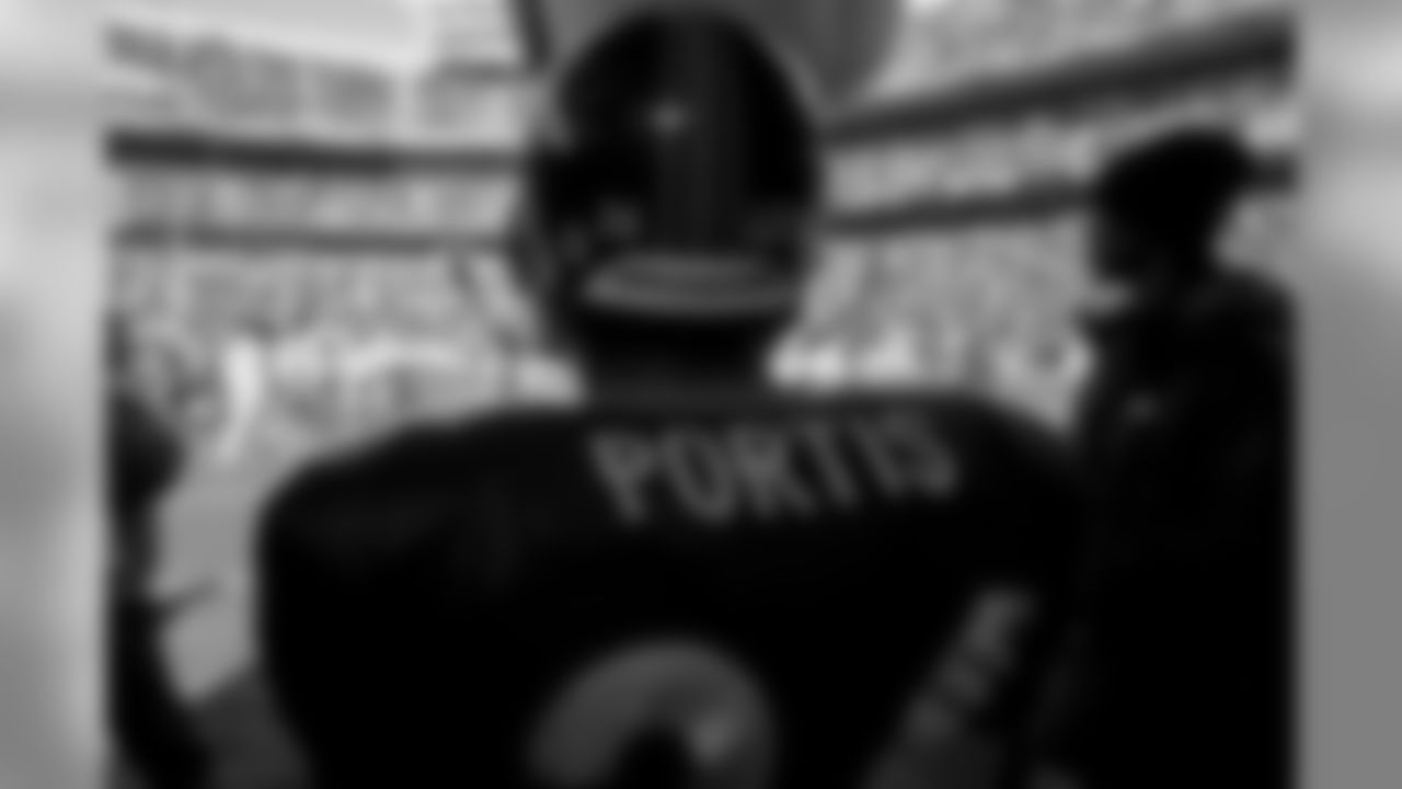 Clinton Portis prepares to take the field during the player introductions against the Chicago Bears at Invesco Field at Mile High in Denver, CO on November 23, 2003.